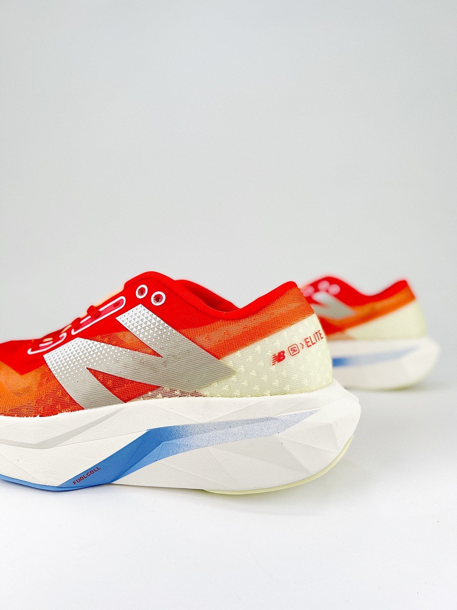 Tênis New Balance Fuelcell Supercomp Elite V4 - Vermelho/Laranja